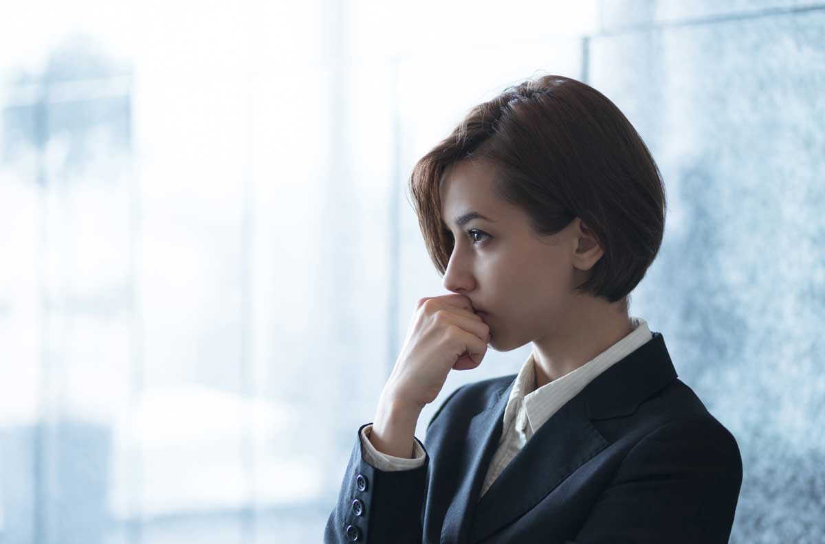 woman thinking about marketing copy and pain points